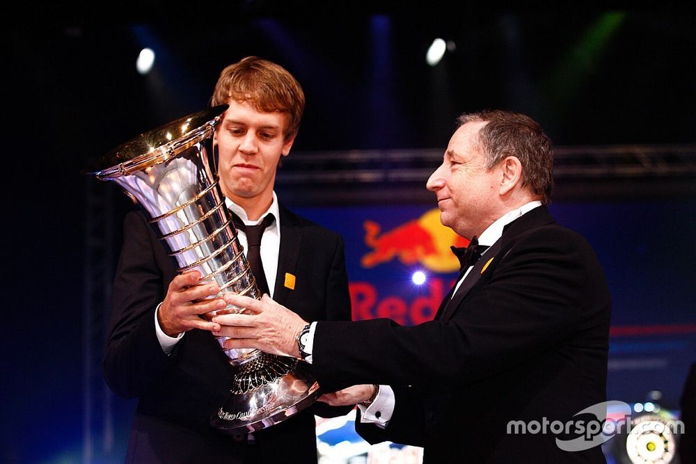 FIA President Jean Todt presents Formula One World Champion Sebastian Vettel with the Drivers' troph