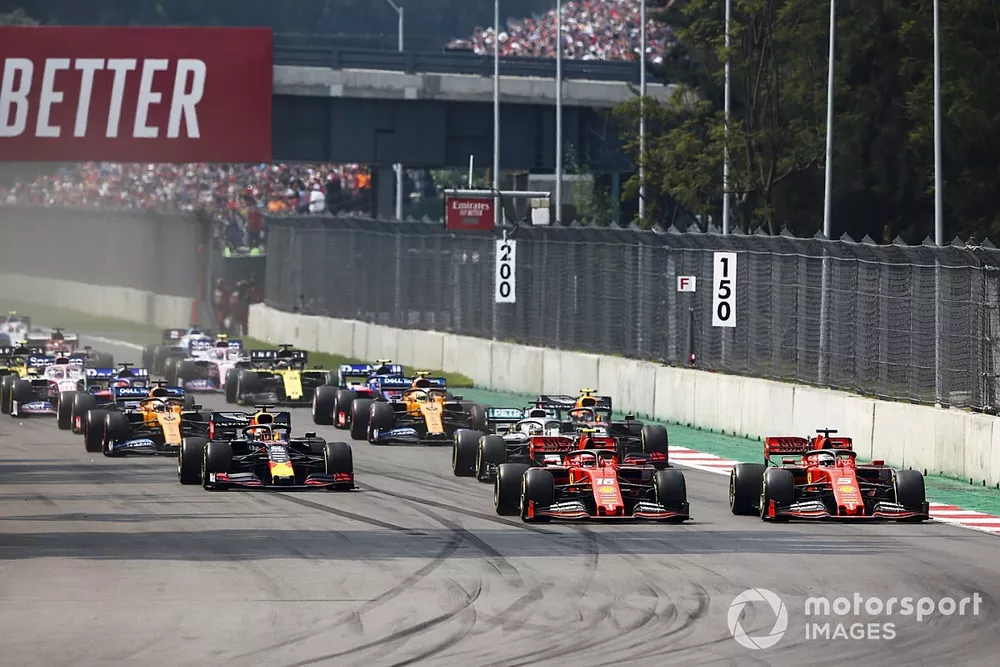 Charles Leclerc, Ferrari SF90, leads Sebastian Vettel, Ferrari SF90, Lewis Hamilton, Mercedes AMG F1 W10, Max Verstappen, Red Bull Racing RB15, Carlos Sainz Jr., McLaren MCL34, and the rest of the field at the start