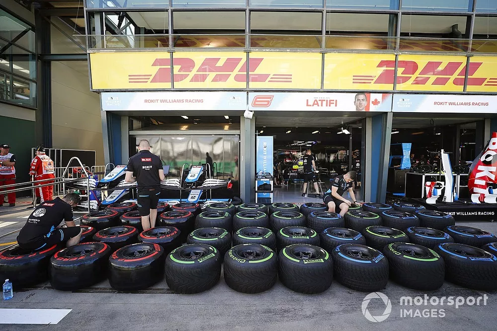 The Williams team prepare tyres in the pits