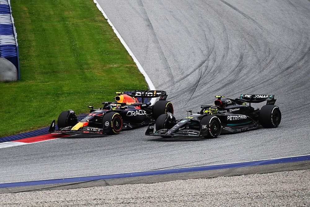 Sergio Perez, Red Bull Racing RB19, battles with Lewis Hamilton, Mercedes F1 W14