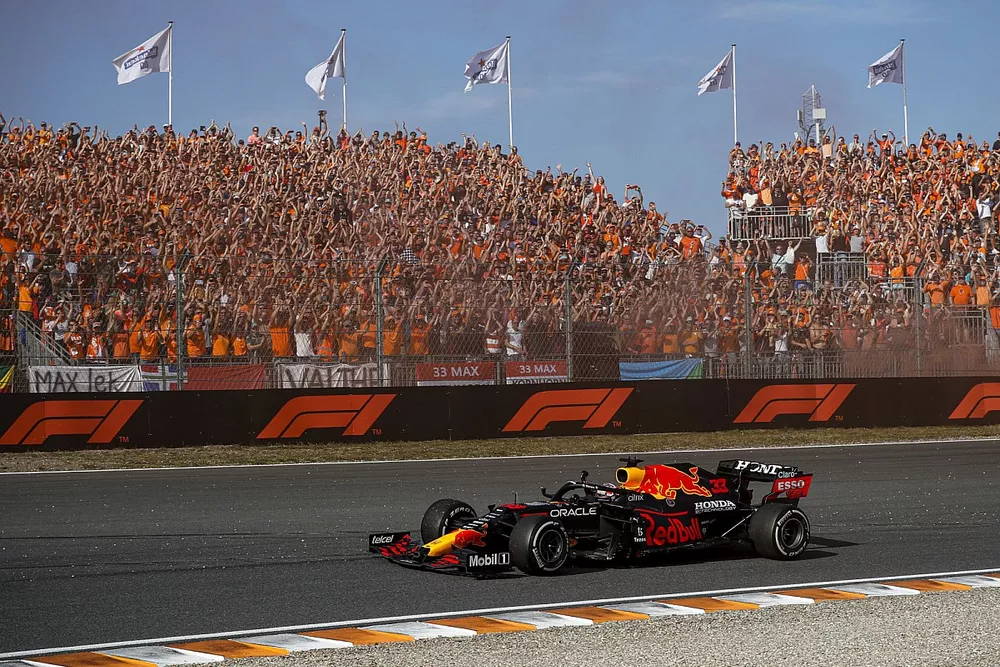 Max Verstappen, Red Bull Racing RB16B, 1st position, waves to fans on his way to Parc Ferme