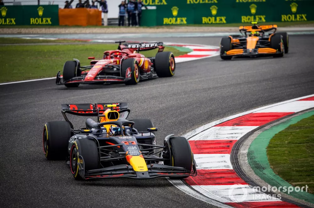 Sergio Perez, Red Bull Racing RB20, leads Charles Leclerc, Ferrari SF-24, and Lando Norris, McLaren MCL38