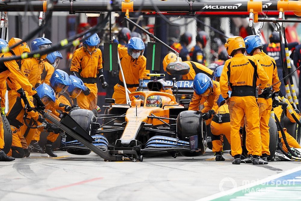 Lando Norris, McLaren MCL35, makes a pit stop