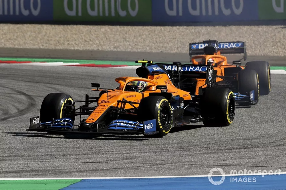 Lando Norris, McLaren MCL35, leads Carlos Sainz Jr., McLaren MCL35