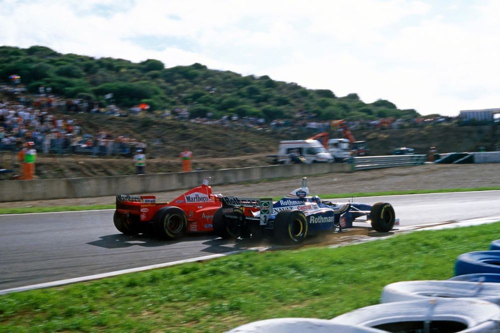 Michael Schumacher (Ferrari F310B), Jacques Villeneuve (Williams FW19 Renault)