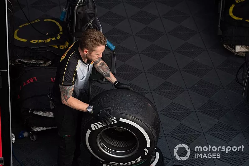 Pirelli technicians work on some tyres