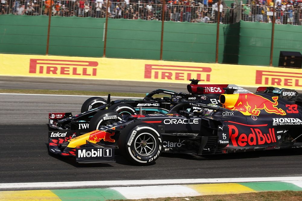 Max Verstappen, Red Bull Racing RB16B, battles with Lewis Hamilton, Mercedes W12