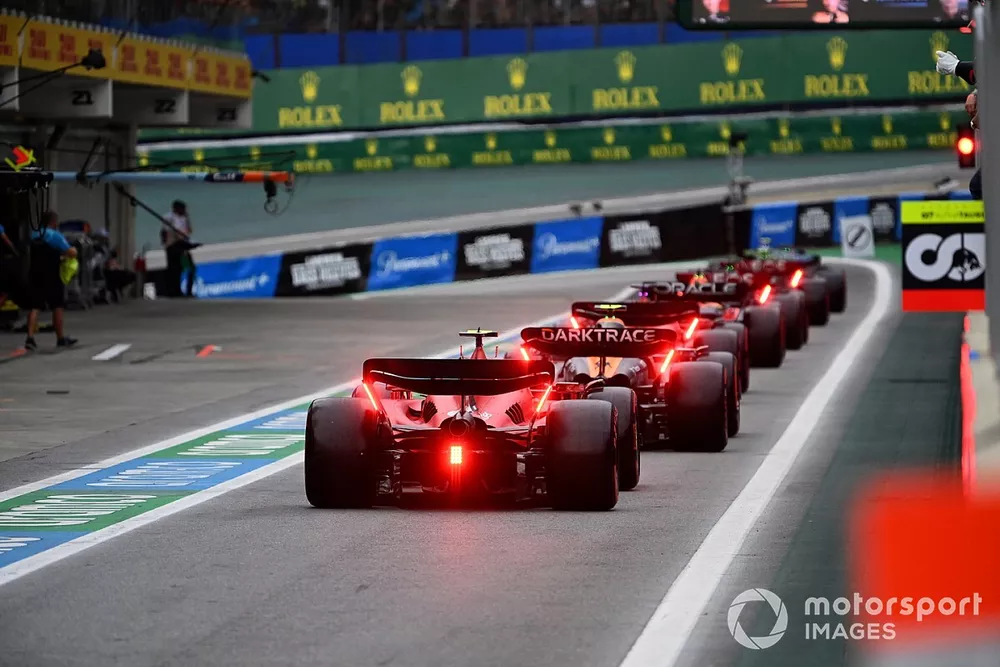 Charles Leclerc, Ferrari SF-23, Lando Norris, McLaren MCL60, Carlos Sainz, Ferrari SF-23, in the pit lane