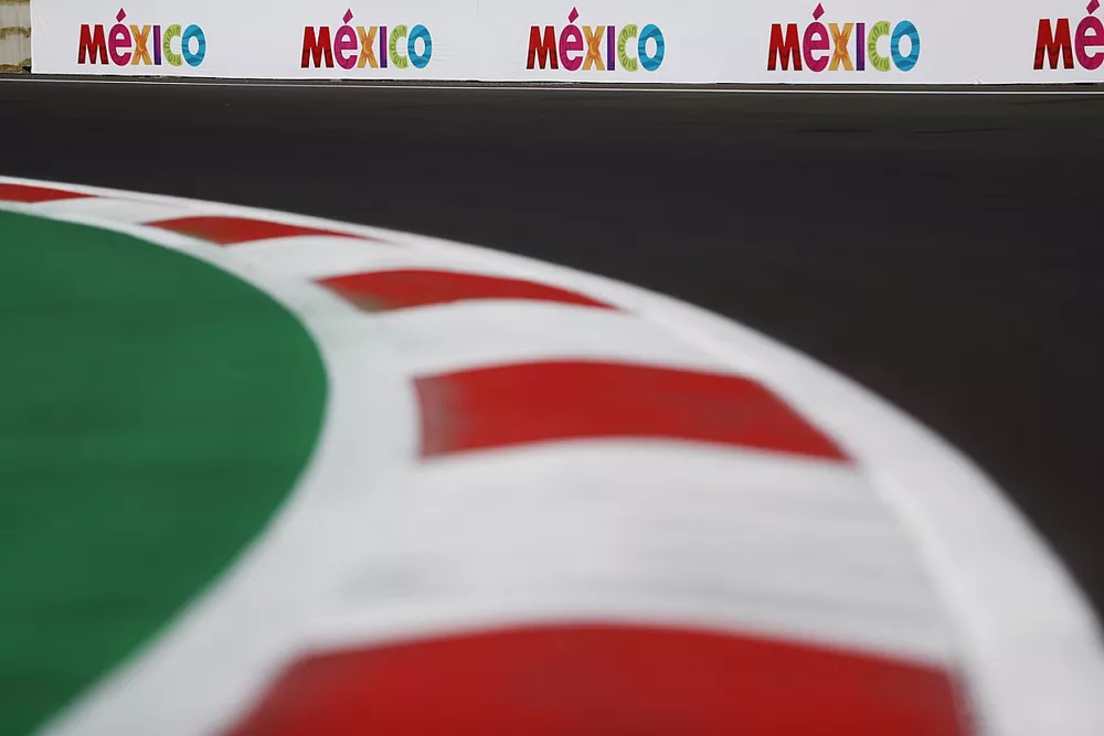 Mexico trackside advertising branding beyond a kerb.