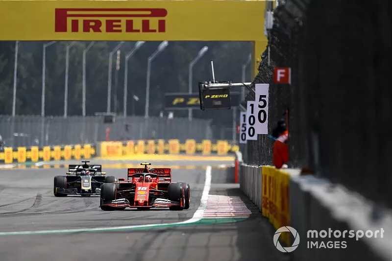 Charles Leclerc, Ferrari SF90, Romain Grosjean, Haas F1 Team VF-19
