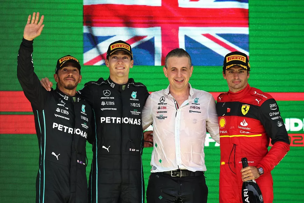 Lewis Hamilton, Mercedes AMG, 2nd position, George Russell, Mercedes AMG, 1st position, Riccardo Musconi, Senior Race Engineer, Mercedes, Carlos Sainz, Ferrari, 3rd position, on the podium