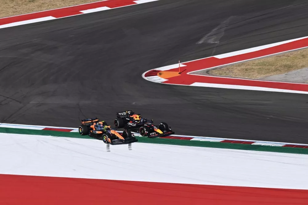 Lando Norris, McLaren MCL38, battles with Max Verstappen, Red Bull Racing RB20 