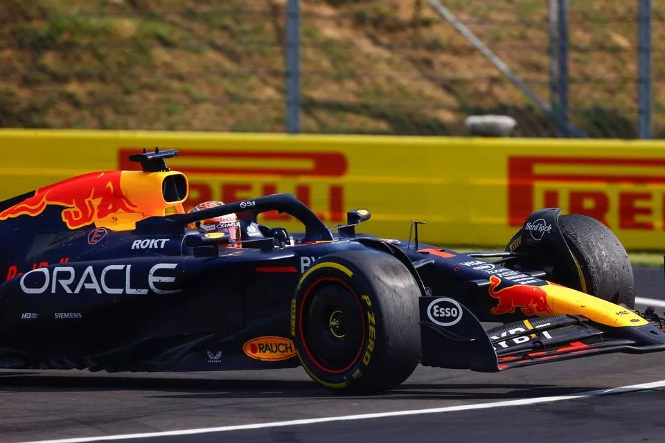 Max Verstappen, Red Bull Racing RB20, recovers after colliding with Lewis Hamilton, Mercedes F1 W15