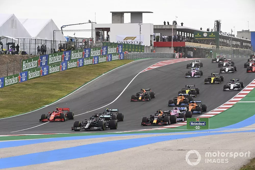 Lewis Hamilton, Mercedes F1 W11, Valtteri Bottas, Mercedes F1 W11, Max Verstappen, Red Bull Racing RB16, leads, Sergio Perez, Racing Point RP20, and the rest of the field at the start