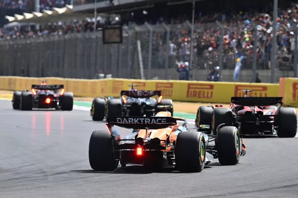 Max Verstappen, Red Bull Racing RB20, leads George Russell, Mercedes F1 W15, Charles Leclerc, Ferrari SF-24, and Lando Norris, McLaren MCL38