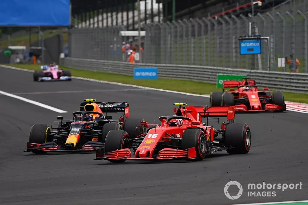 Charles Leclerc, Ferrari SF1000, battles with Alex Albon, Red Bull Racing RB16, ahead of Sebastian Vettel, Ferrari SF1000