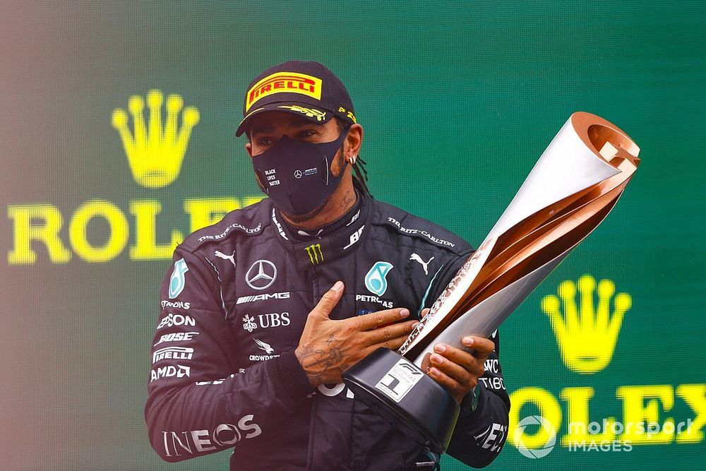 Race Winner Lewis Hamilton, Mercedes-AMG F1 celebrates on the podium with the trophy