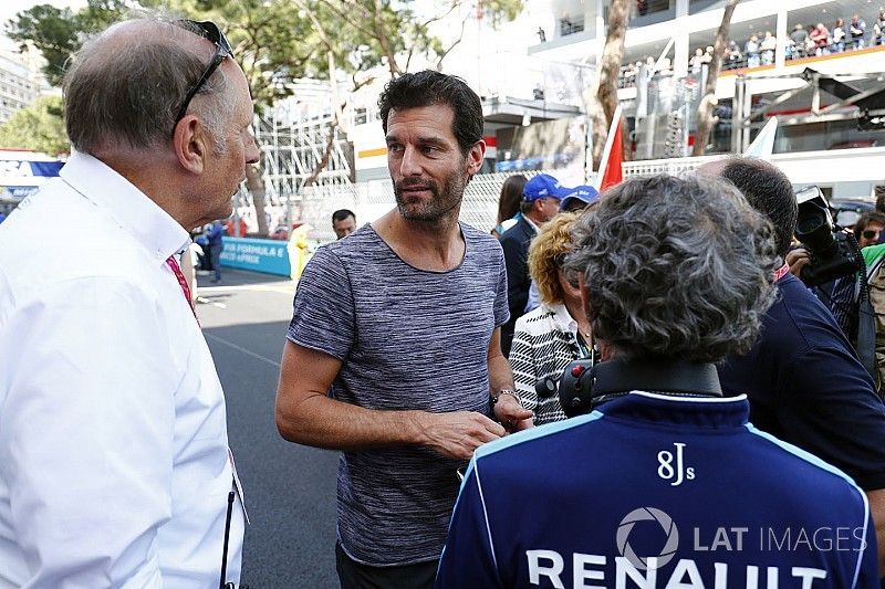 Mark Webber con Alain Prost en la parrilla