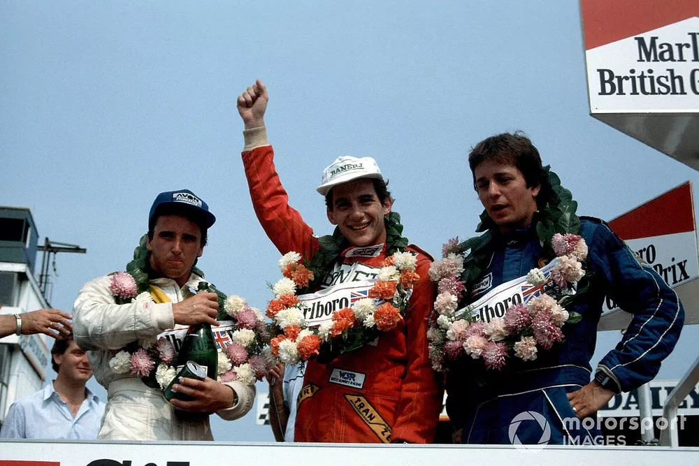 Calvin Fish, Ayrton Senna and Martin Brundle celebrate on the podium