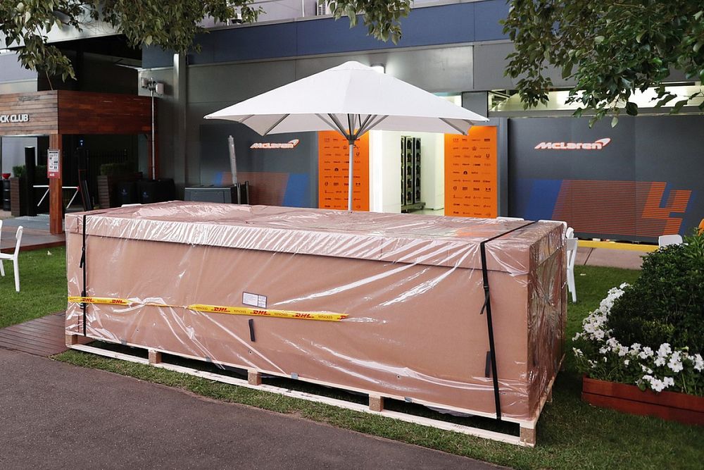 Packing crates outside the McLaren garage in the paddock