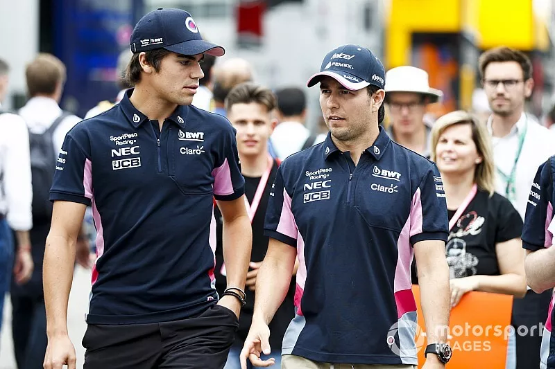 Lance Stroll, Racing Point y Sergio P&eacute;rez, Racing Point en el paddock 