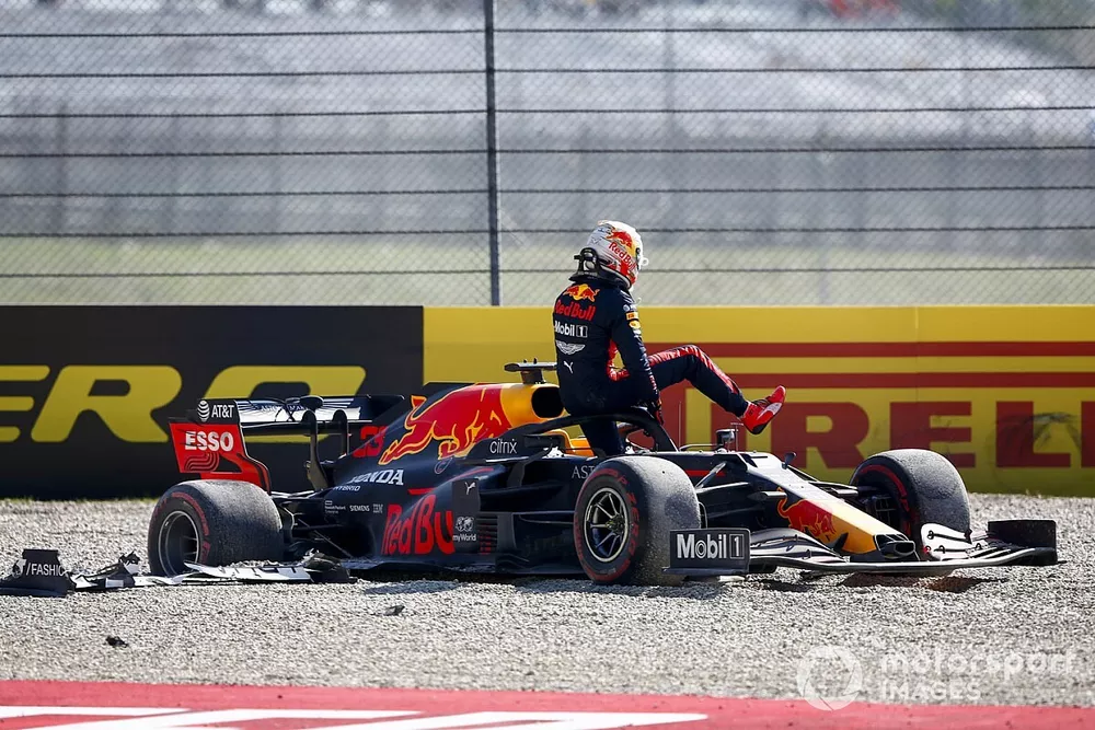 Max Verstappen, Red Bull Racing RB16, climbs out of his car after retiring in a first lap incident