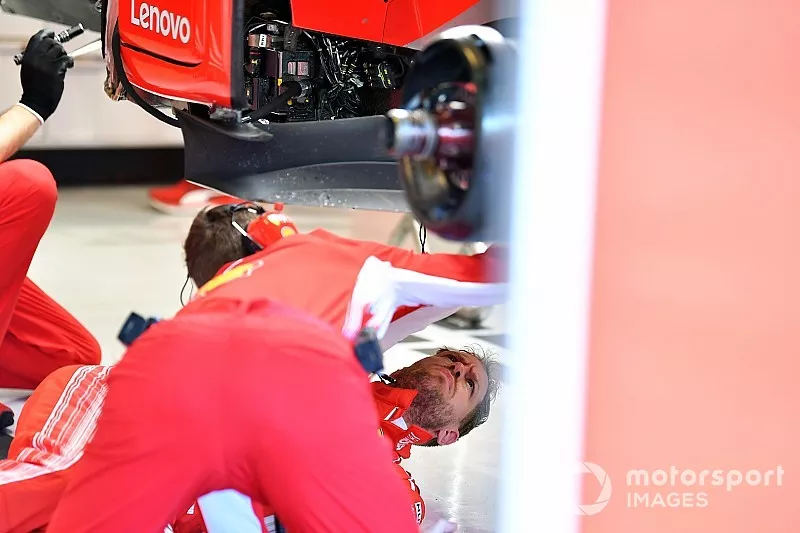 Sebastian Vettel, Ferrari on the garage floor under the Ferrari SF71H