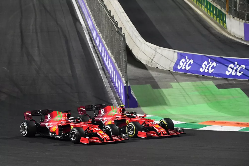 Charles Leclerc, Ferrari SF21, battles with Carlos Sainz Jr., Ferrari SF21