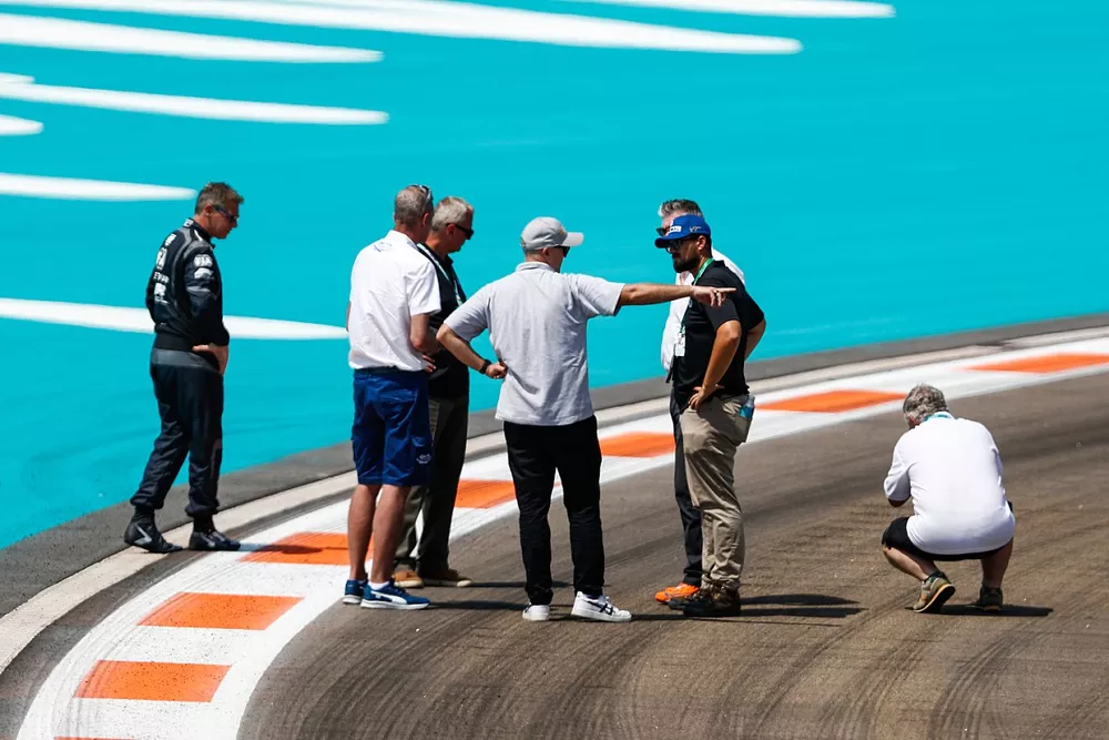 Officials, including Niels Wittich, Race Director, FIA, Bernd Maylander, Safety Car Driver, inspect the track