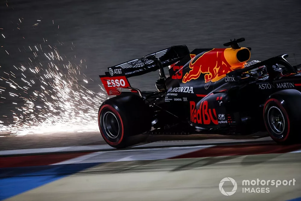Max Verstappen, Red Bull Racing RB16, kicks up some sparks