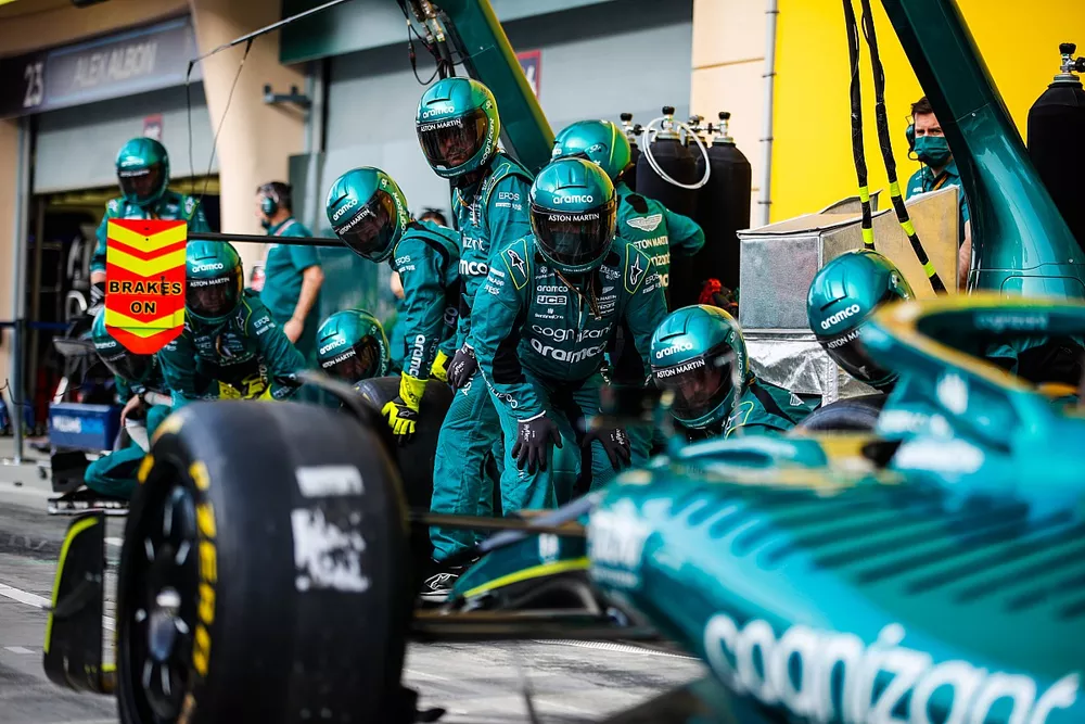 The Aston Martin team practice a pit stop