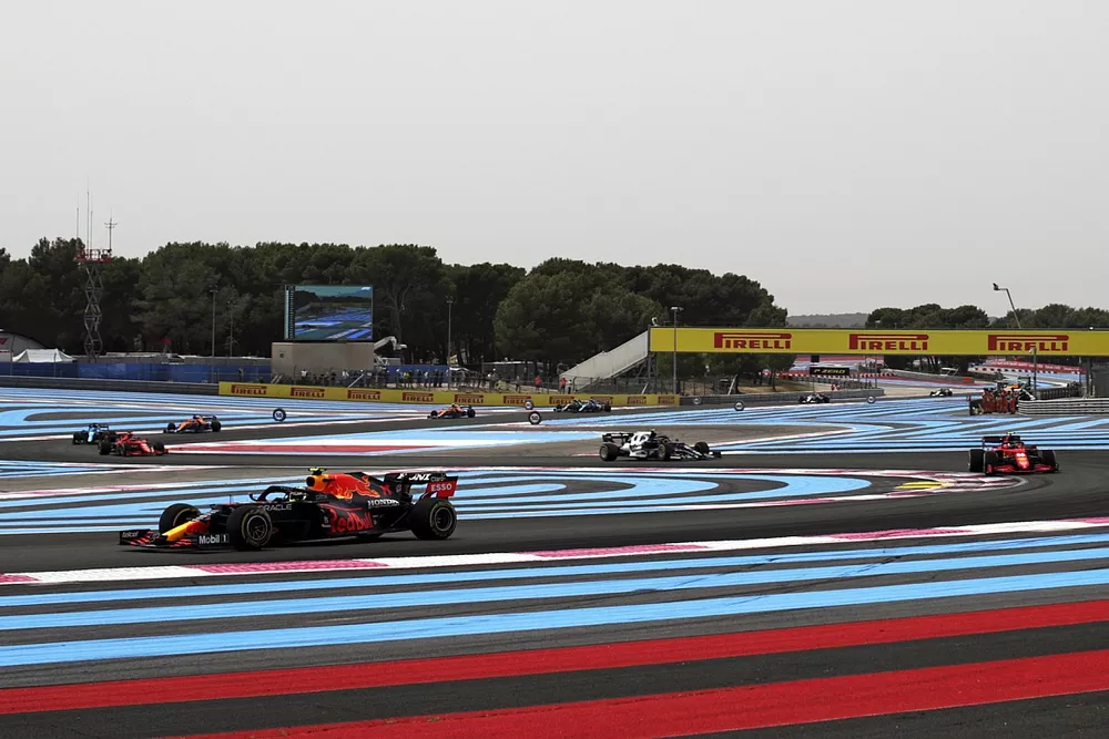 Sergio Perez, Red Bull Racing RB16B, leads Charles Leclerc, Ferrari SF21, and Pierre Gasly, AlphaTauri AT02