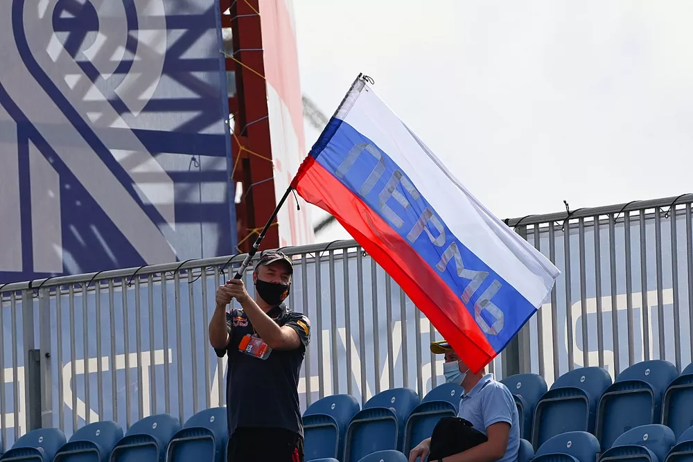 Man waves Russian flag