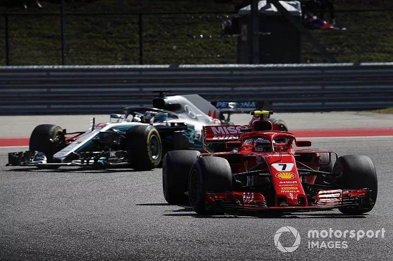 Kimi Raikkonen, Ferrari SF71H, leads Lewis Hamilton, Mercedes AMG F1 W09 EQ Power+