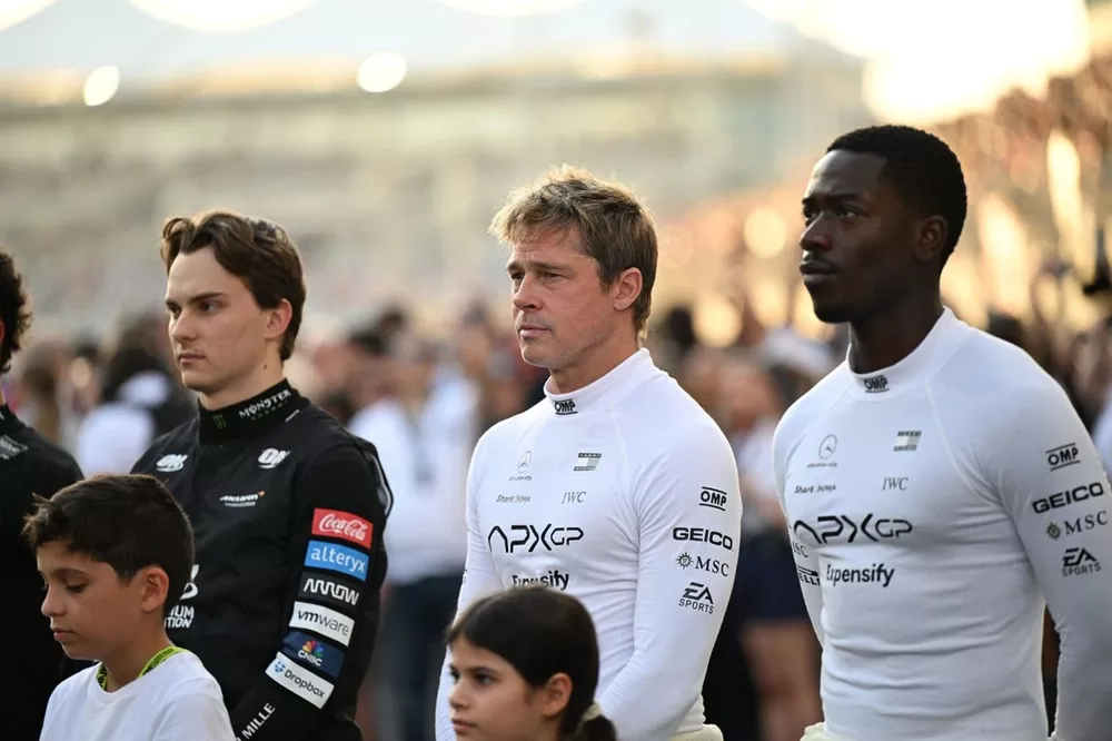 Brad Pitt and Damson Idris with Oscar Piastri, McLaren F1 Team, whilst filming on the grid for the F1 movie