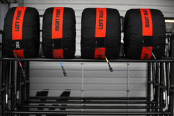 Pirelli tyres in their warmers on a rack