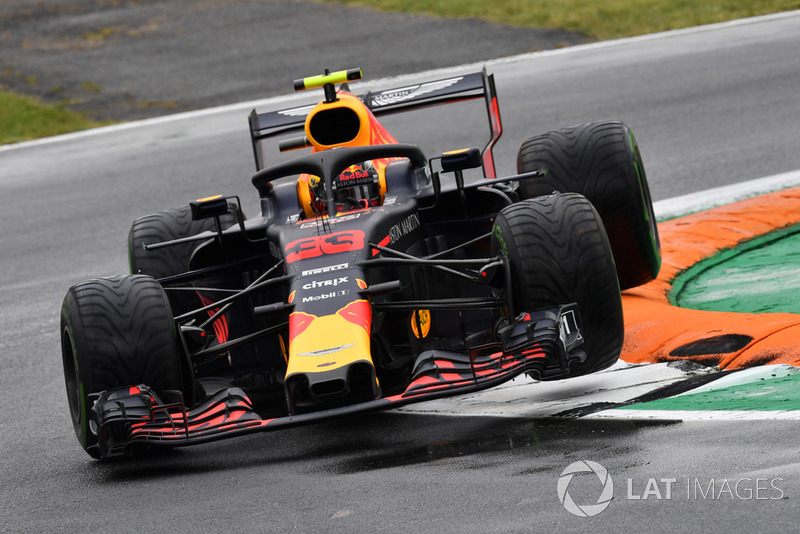 Max Verstappen, Red Bull Racing RB14 jumps over the kerb