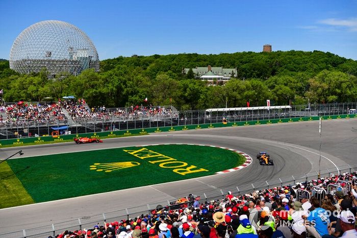 Lando Norris, McLaren MCL34, leads Charles Leclerc, Ferrari SF90