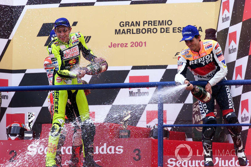 Podium: The winner of the 2001 Spanish GP 500 race Valentino Rossi, Honda, and third place Alex Criville, Honda, celebrate success on the podium.