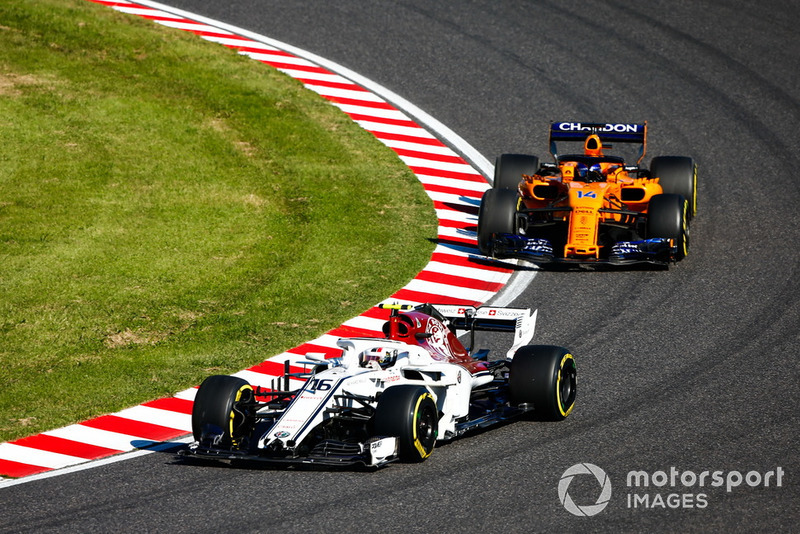 Charles Leclerc, Sauber C37, leads Fernando Alonso, McLaren MCL33