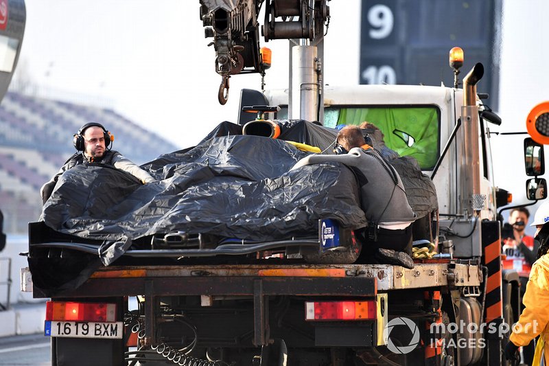 The car of Lando Norris, McLaren MCL34 is recovered to the pits