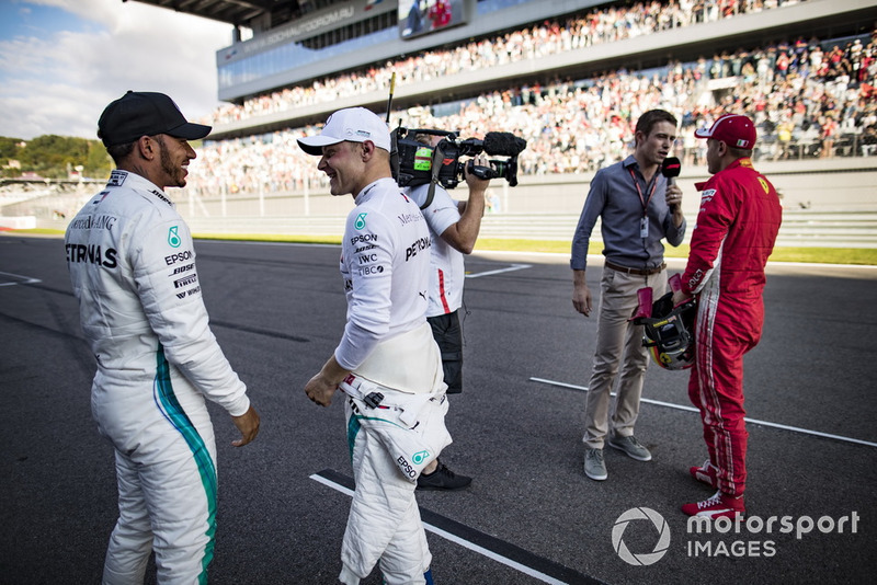 Lewis Hamilton, Mercedes AMG F1, congratulates his team mate Valtteri Bottas, Mercedes AMG F1