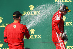 Sebastian Vettel, Ferrari, 2nd position, sprays Kimi Raikkonen, Ferrari, 3rd position, with Champagne