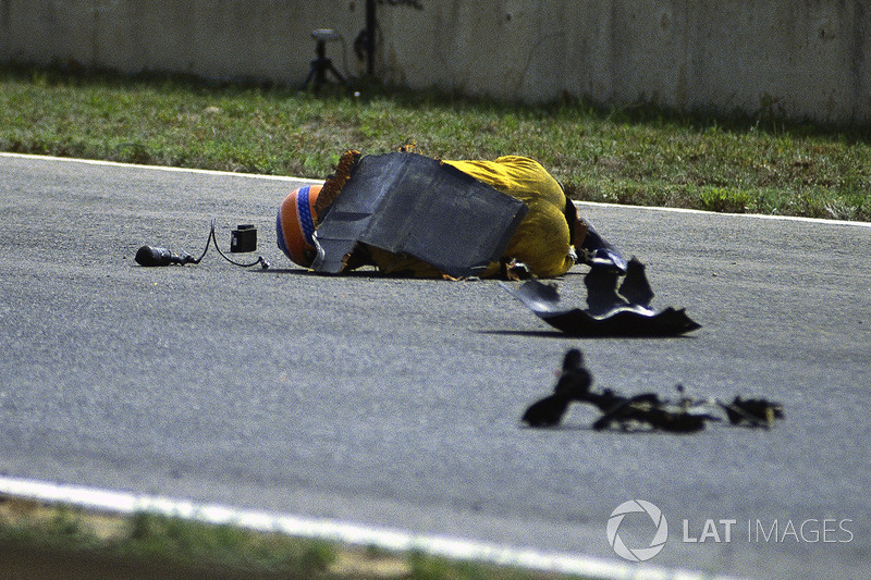 Martin Donnelly, Team Lotus, lies on the track after a horrific crash