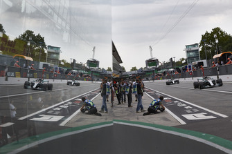 Lewis Hamilton, Mercedes AMG F1 W09, leads Valtteri Bottas, Mercedes AMG F1 W09, in the pit lane