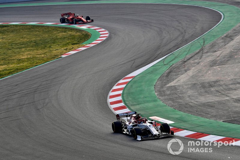 Kimi Raikkonen, Alfa Romeo Racing C38, leads Sebastian Vettel, Ferrari SF90 