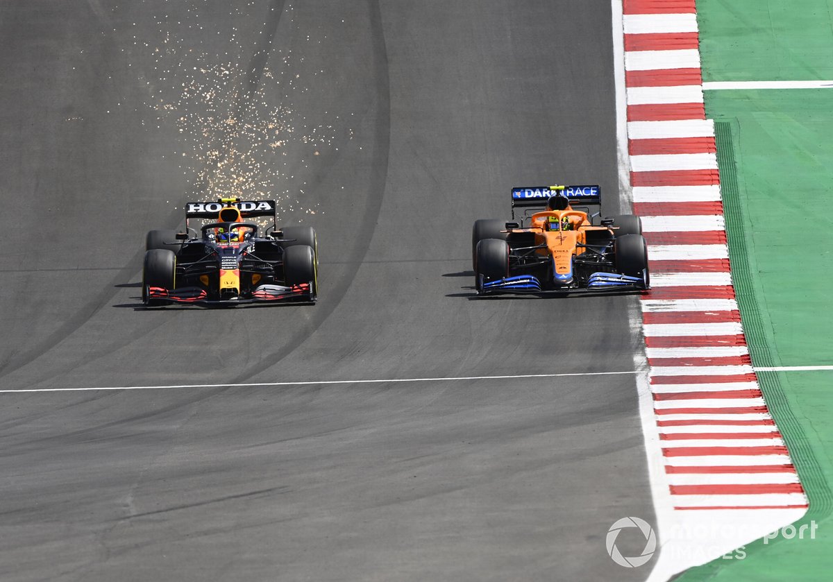 Sparks fly as Sergio Perez, Red Bull Racing RB16B, battles with Lando Norris, McLaren MCL35M