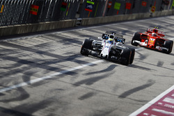 Felipe Massa, Williams FW40, Kimi Raikkonen, Ferrari SF70H, in the pit lane