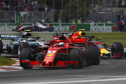 Sebastian Vettel, Ferrari SF71H, leads Valtteri Bottas, Mercedes AMG F1 W09 and Max Verstappen, Red