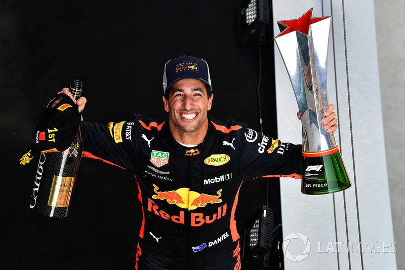 Race winner Daniel Ricciardo, Red Bull Racing celebrates on the podium with the trophy